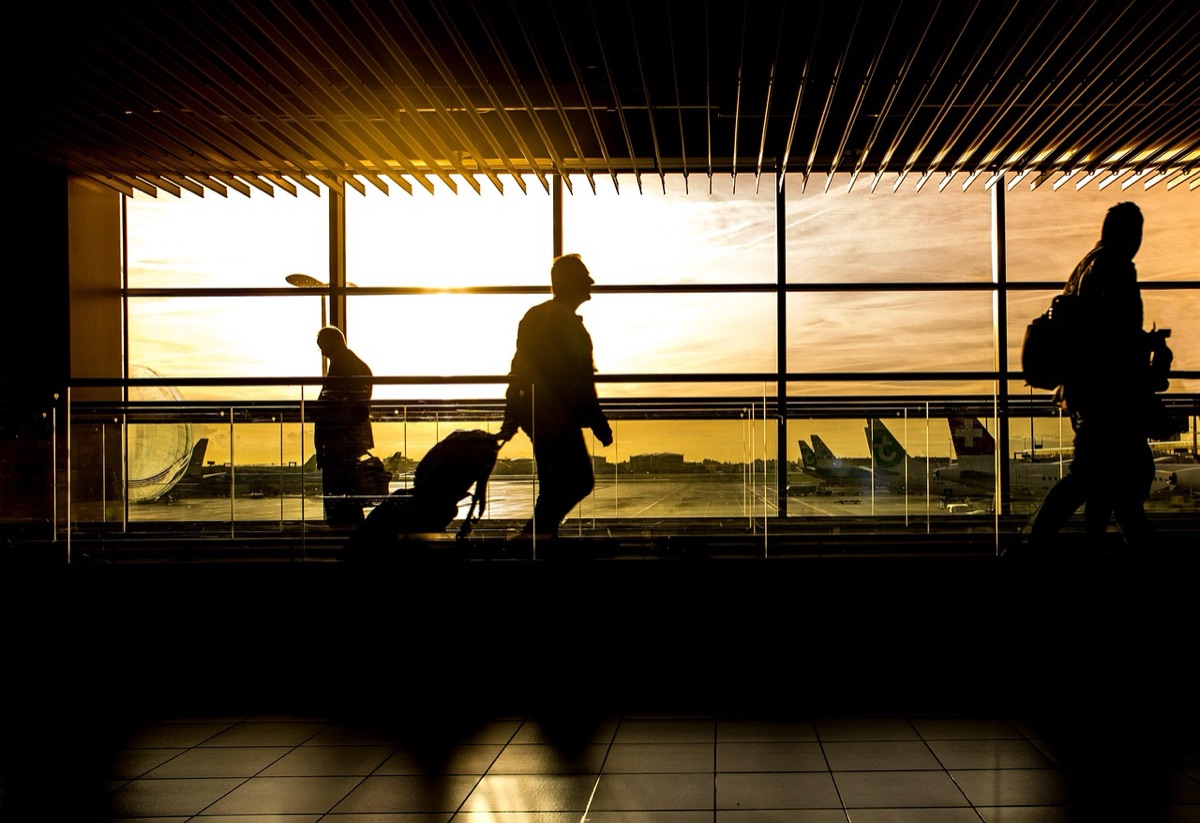 Airport terminal in Shanghai with travelers and staff